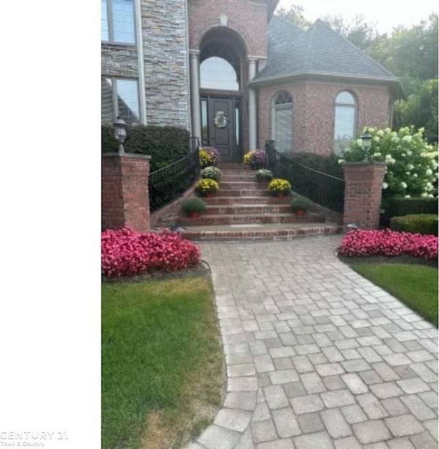 property entrance featuring brick siding