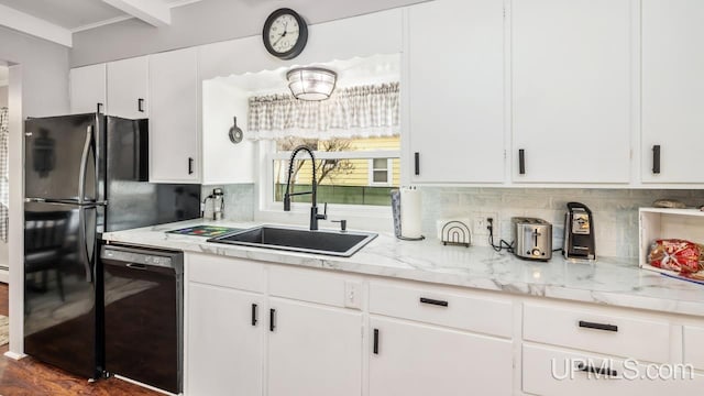 kitchen with black appliances, a sink, white cabinets, and decorative backsplash