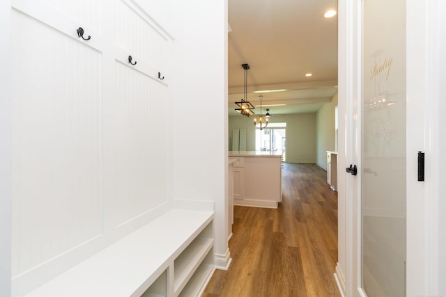 mudroom featuring wood finished floors and recessed lighting