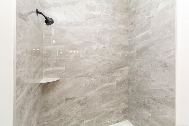 bathroom with a tile shower