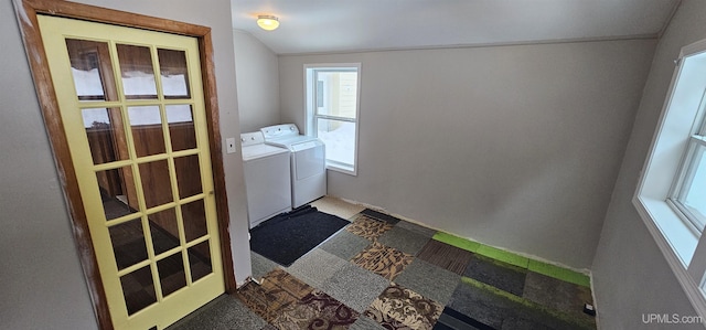 clothes washing area with washing machine and dryer and laundry area