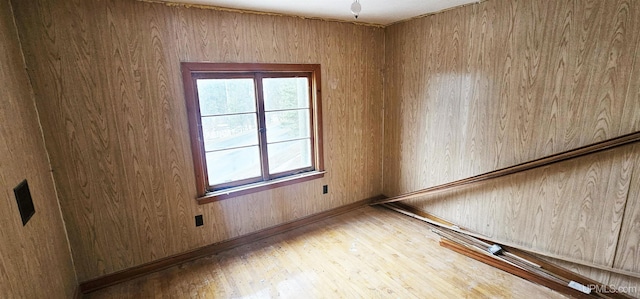 empty room featuring wood-type flooring