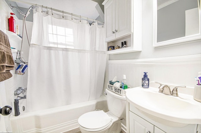 full bathroom with toilet, vanity, shower / tub combo with curtain, and wainscoting