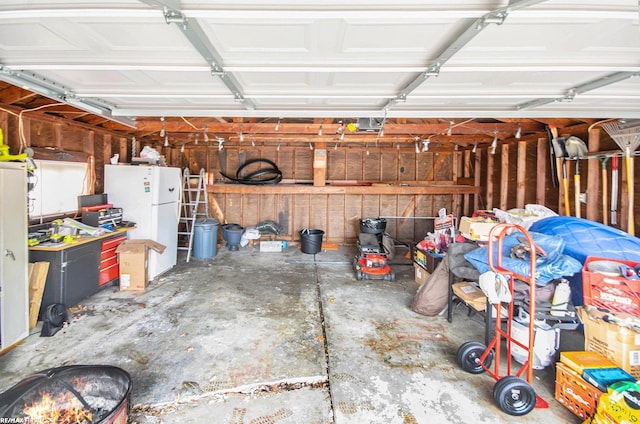 garage with freestanding refrigerator