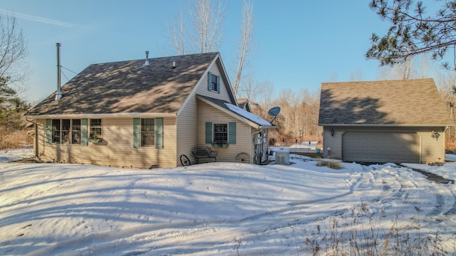 view of snow covered exterior featuring central air condition unit