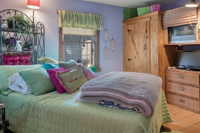 bedroom featuring light wood-style flooring