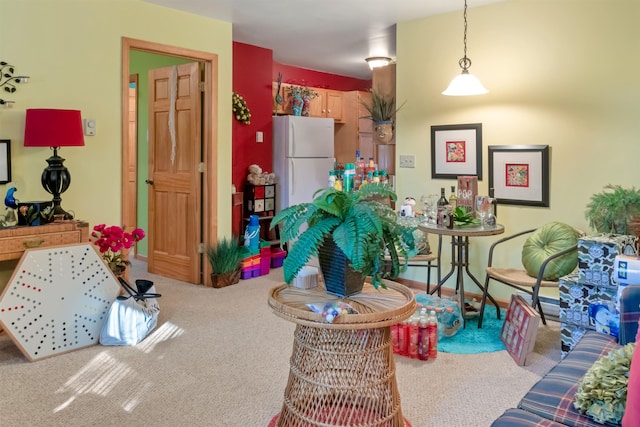 interior space featuring carpet and baseboards