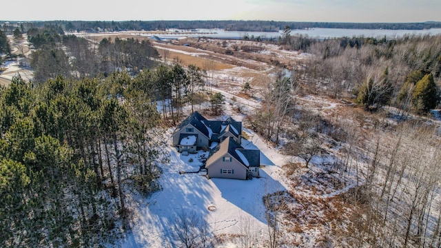 drone / aerial view featuring a forest view