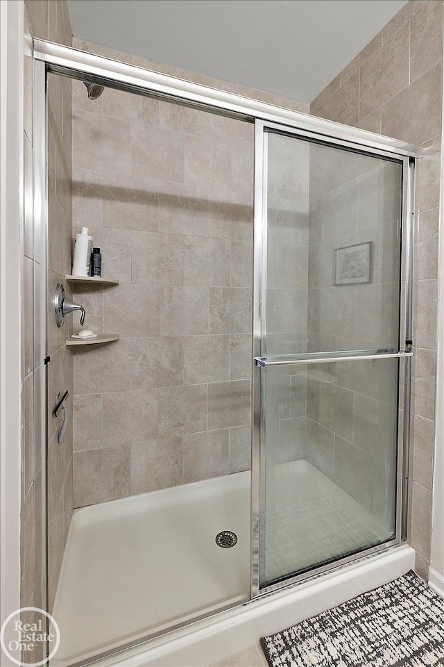 full bath featuring a stall shower