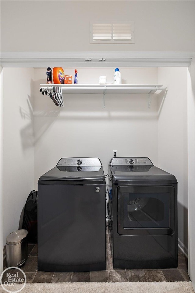 washroom with laundry area and washer and clothes dryer