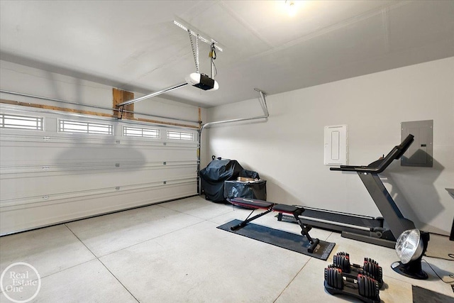 garage featuring a garage door opener and electric panel