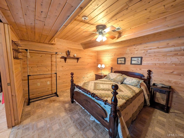 carpeted bedroom featuring wooden ceiling, wooden walls, and beam ceiling