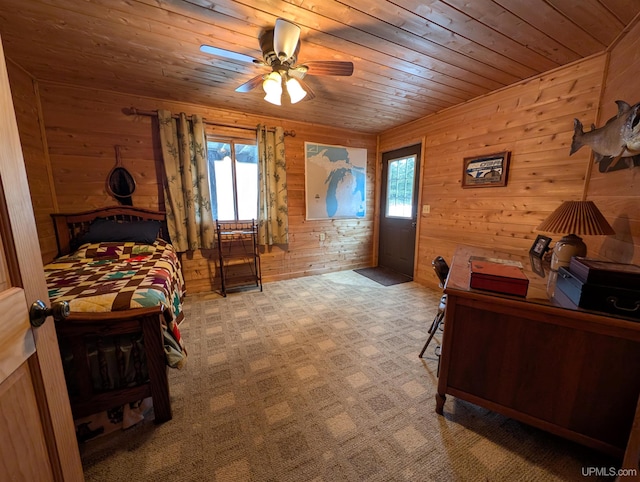 bedroom featuring carpet floors, wood walls, multiple windows, and wood ceiling