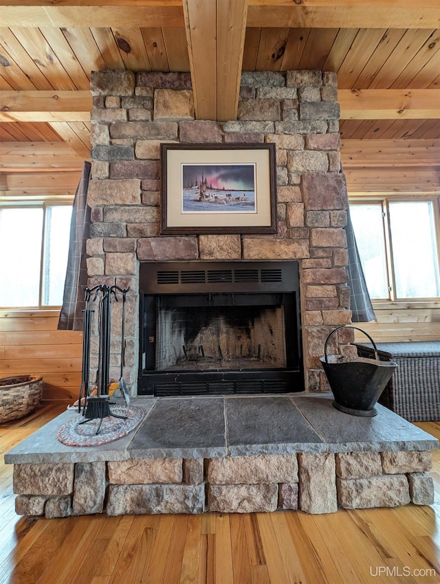 details with wood ceiling, a fireplace, wood finished floors, and beamed ceiling