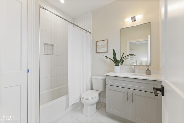 bathroom featuring toilet, marble finish floor, shower / tub combo with curtain, and vanity