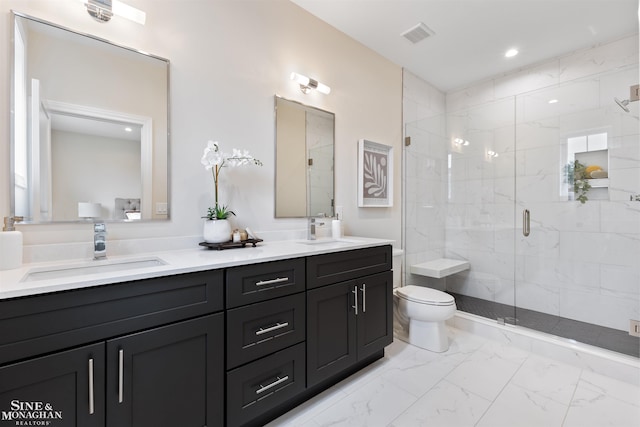 full bath featuring marble finish floor, a stall shower, a sink, and toilet