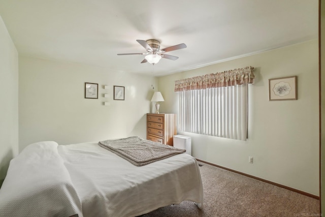 bedroom featuring ceiling fan, carpet flooring, and baseboards