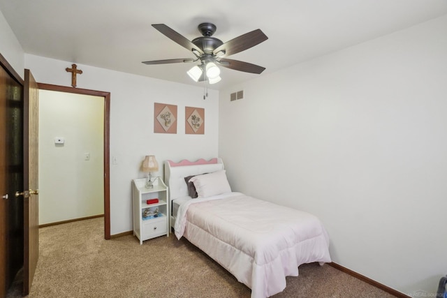 bedroom featuring light carpet, baseboards, and visible vents