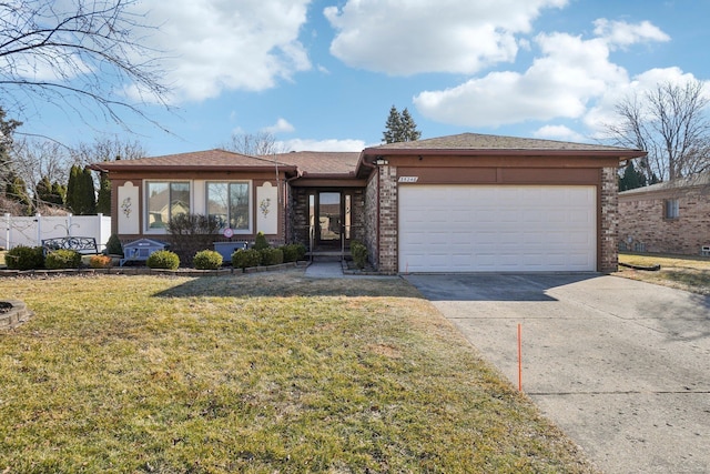 view of front of property featuring a garage, concrete driveway, fence, a front lawn, and brick siding