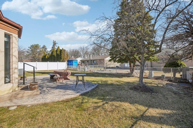 view of yard with a fenced backyard and a patio