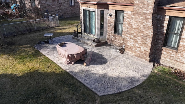 view of yard with entry steps, a patio, and fence