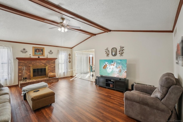 living room with crown molding, vaulted ceiling with beams, a brick fireplace, a textured ceiling, and wood finished floors