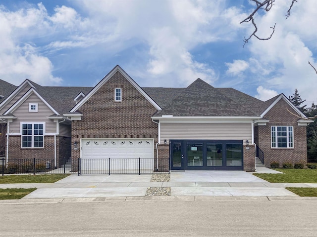 ranch-style house with a garage, brick siding, driveway, and fence