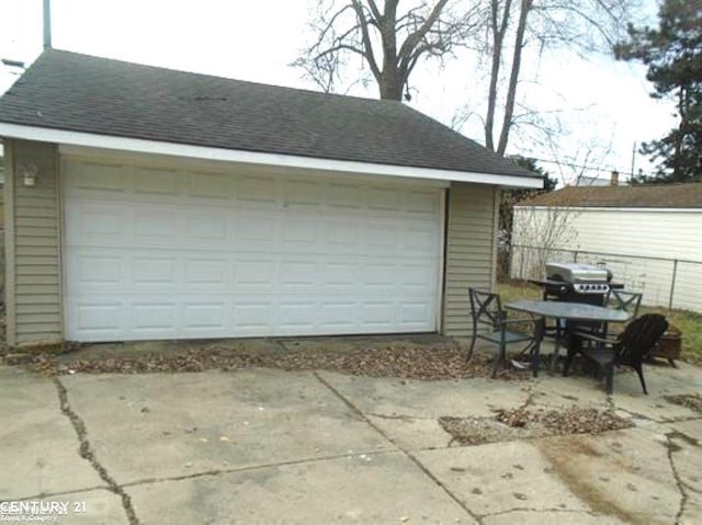 garage with fence