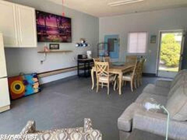 dining space featuring baseboards