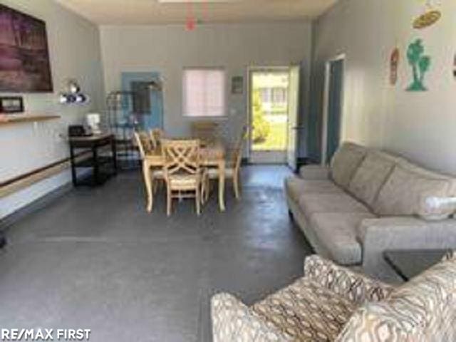 living room with concrete floors