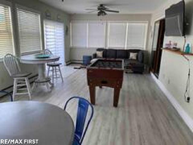 playroom featuring ceiling fan and light wood-style floors