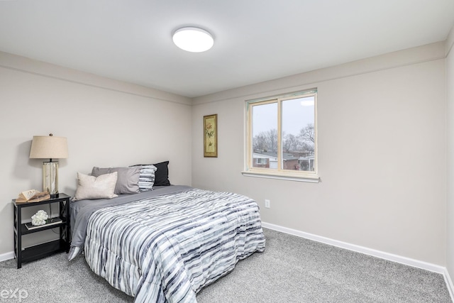 carpeted bedroom with baseboards