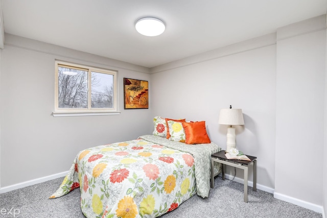 carpeted bedroom with baseboards