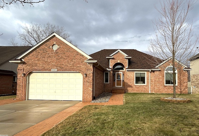 view of front of property featuring brick siding, a shingled roof, an attached garage, driveway, and a front lawn