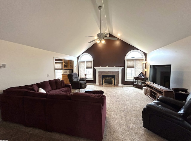 living area featuring carpet floors, a fireplace, high vaulted ceiling, and a ceiling fan