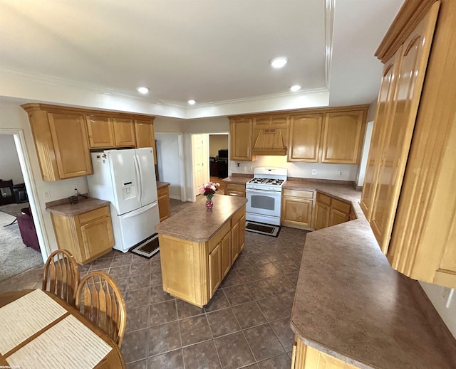 kitchen featuring recessed lighting, premium range hood, white appliances, a kitchen island, and crown molding