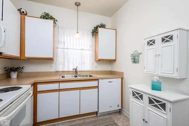 kitchen with pendant lighting, light countertops, white cabinetry, a sink, and white appliances