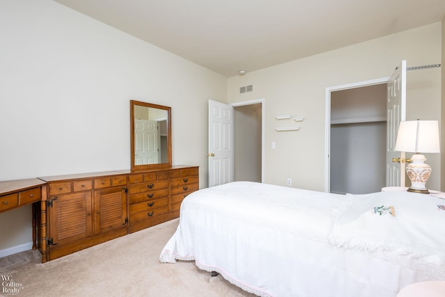 bedroom featuring a closet, carpet, and visible vents