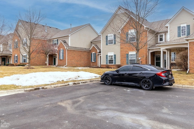 view of front of home featuring brick siding