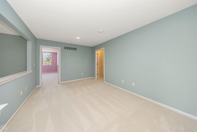 unfurnished room featuring recessed lighting, visible vents, baseboards, and light colored carpet