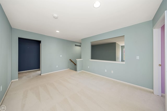 carpeted empty room featuring recessed lighting, baseboards, and visible vents