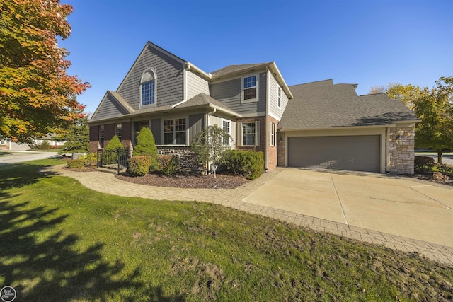 view of front of home featuring brick siding, a garage, concrete driveway, and a front lawn