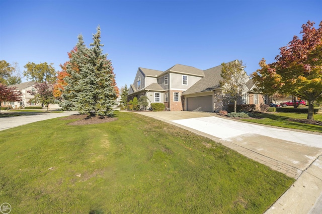 view of front of home with concrete driveway and a front yard