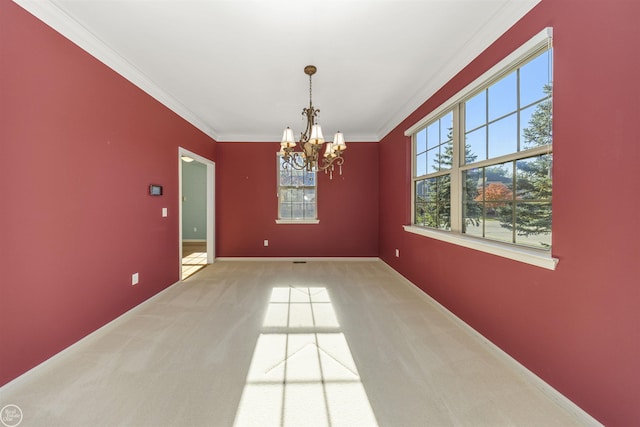 empty room with baseboards, light carpet, an inviting chandelier, and ornamental molding