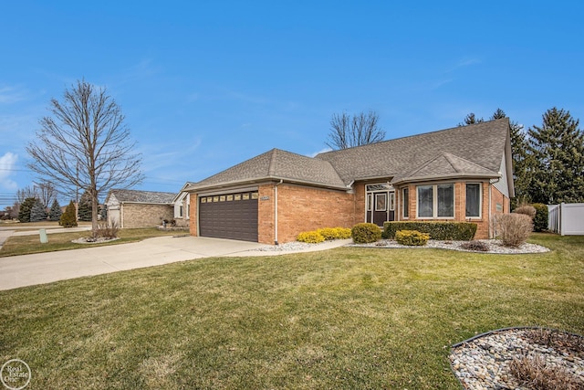 view of front of property with a front lawn, brick siding, driveway, and an attached garage