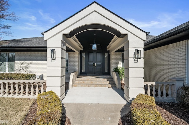 entrance to property with brick siding