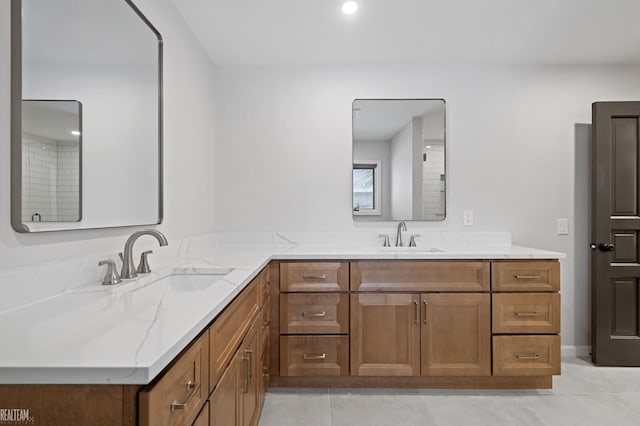 full bathroom featuring tile patterned flooring, a sink, and double vanity