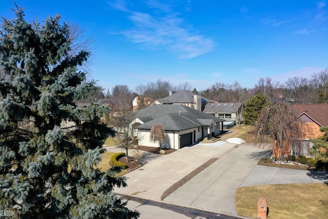 view of front of home with a garage and concrete driveway