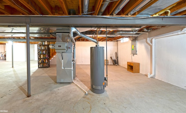 unfinished basement featuring heating unit, electric panel, and gas water heater