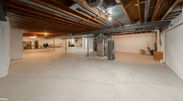 unfinished basement featuring gas water heater